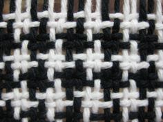 the black and white woven material is close up