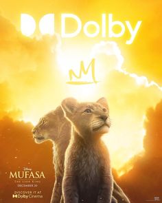 two lions sitting on top of each other in front of a sky with clouds and the words, da dobby m