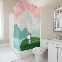 a white toilet sitting next to a shower curtain