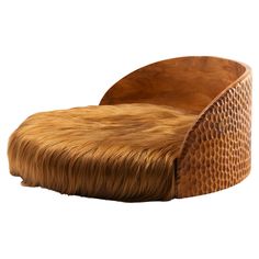 a wooden chair with long hair on it's back legs and seat cushion in the shape of a snake skin