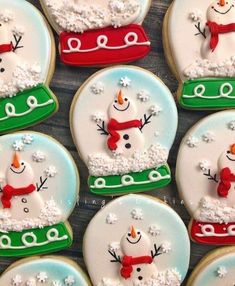 decorated cookies with snowmen and hats on them