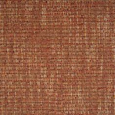 an orange and brown fabric textured with small squares on the top, in different colors