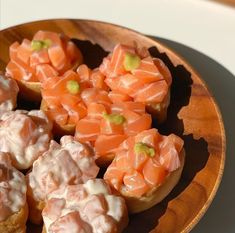 some food is sitting on a wooden plate