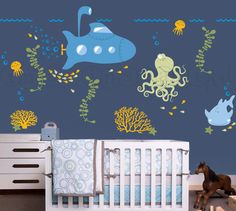 a baby's room with an ocean theme wall decal