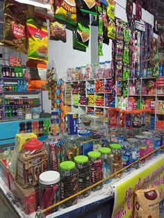 a store filled with lots of different types of food and drinks on display next to each other