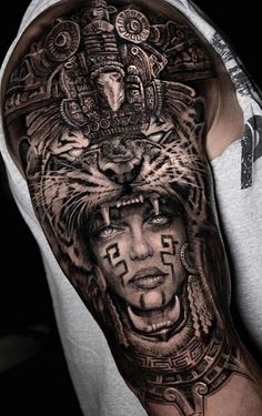 a man with a tiger tattoo on his arm and shoulder, wearing a headdress