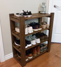 a wooden shelf filled with lots of shoes