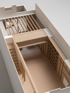 an overhead view of a model house with stairs leading up to the second floor bedroom