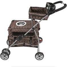 a baby stroller with a dog in it and its carrier attached to the handle