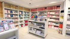 the inside of a store filled with lots of shelves and boxes on top of them