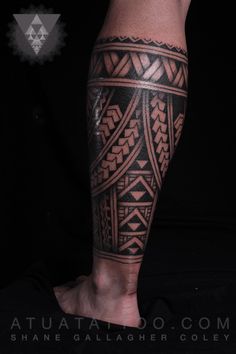 a man's leg with an intricate tattoo design on the calf and lower half