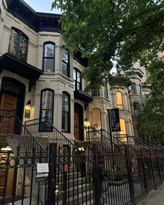 a row of houses with wrought iron railings