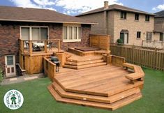 a large wooden deck in the middle of a yard