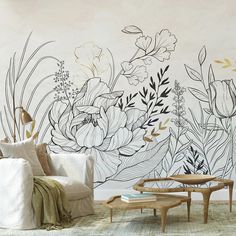 a living room wall with flowers painted on it