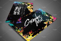 an artistic business card with colorful paint splattered on the front and back side