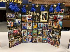 a bulletin board decorated with pictures and tassels for graduation party guests to sign