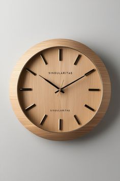 a wooden clock with roman numerals on the face