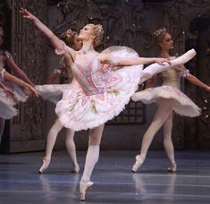 ballet dancers in pink tutus and white dresses