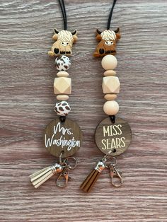 two key chains with wooden beads and charms