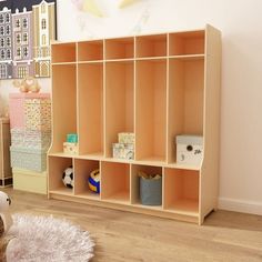 a child's room with toys and bookshelves on the floor, including a teddy bear