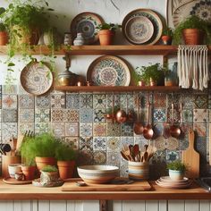 pots and pans are sitting on the shelf above the kitchen sink in this colorful tile backsplash