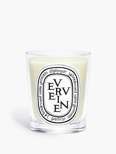 a candle that is sitting on top of a white surface with the words, ever en written