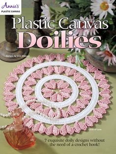 the cover of plastic canvass doilies with pink and white crochet designs