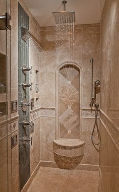 an image of a bathroom with shower head and hand held showerhead in the corner