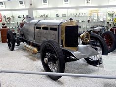 an antique car on display in a museum