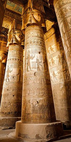 the columns are decorated with ancient egyptian paintings