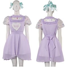 two mannequins dressed in purple dresses with hearts on the front and back