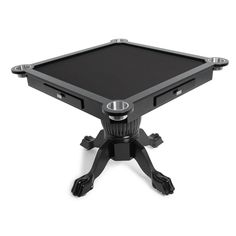 a black table top sitting on top of a white floor