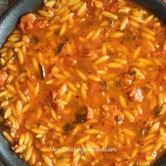 a skillet filled with pasta and sauce