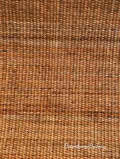 close up view of the woven material on top of a wicker tablecloth, which is brown and tan