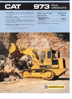 the back end of a bulldozer is shown in front of a pile of rocks