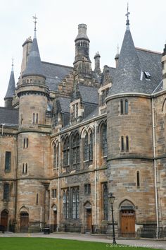 an old building with many windows and towers