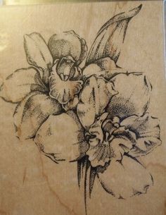 a drawing of flowers on a piece of wood