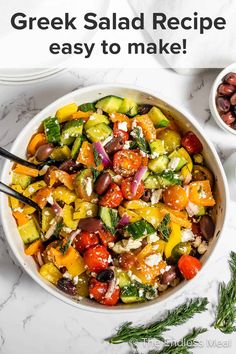 greek salad recipe in a bowl with olives and tomatoes