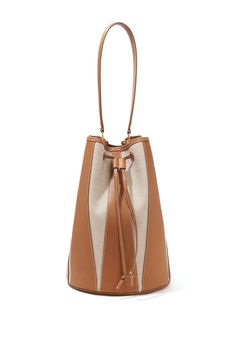 The Large ‘Drum’ bag is shaped in Spain from neutral canvas with harlequin-inspired paneling made from tan leather. It features a drawstring top closure and is hallmarked with an Altuzarra stamped logo. Drawstring Top, Leather Bucket Bag, Brand Collection, Knitwear Tops, Handbag Shoes, Canvas Leather, Favorite Dress, Large Bags, Tan Leather