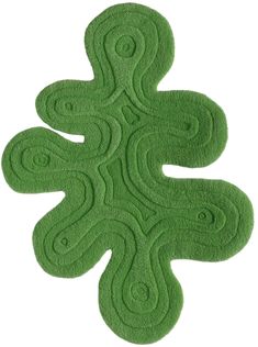 a green rug that is shaped like a flower