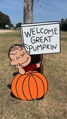 a sign that says welcome to great pumpkin with a cartoon character holding a jack - o'- lantern