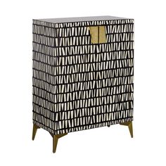 a black and white cabinet with geometric designs on the front, gold handles and wooden legs