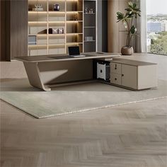 an office desk with a laptop on it in front of a bookcase and window