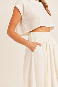 DescriptionFeel like a vacay goddess with The Santorini Set. Dress up or down with this beautiful set and you can be a casual gal on a Wednesday afternoon or a brunch babe on a Sunday morning. The Santorini skirt features a cinched elastic waistband, pockets, and cotton lining. And The Santorini top features side slits, a crew neck neckline, and a cropped fit. FitTrue to size. MaterialTop: 95% Rayon, 5% SpandexSkirt: 95% Rayon, 5% Spandex100% Cotton Lining Night Skirt, Night Tops, Crop Top Set, Midi Flare Skirt, Cotton Labels, Crop Top Skirt, Midi Length Skirts, Linen Skirt, Scarf Hairstyles