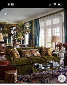 a living room filled with furniture and lots of windows