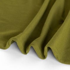 Made from a blend of cotton and modal fibers, this midweight jersey is naturally soft with a lovely relaxed drape. This knit blend is fully opaque with a healthy dose of stretch which makes it ultra-versatile and comfortable to wear. Gütermann Thread Match: Bronzite #775 Content: 57.5% Cotton / 37.5% Modal / 5% SpandexWidth: 148cm / 58"Weight: 200gsm / 5.9ozOpacity: OpaqueStretch: 4 way stretch, 70% cross-grain / 60% along grain-lineDrape: SoftCountry of Origin: South Korea Share your makes with Garment Fabric, Black Bird, Knit Jersey, South Korea, Basil, Knitting