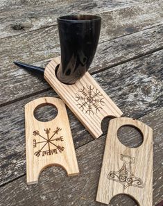 two wooden bottle openers sitting on top of a table