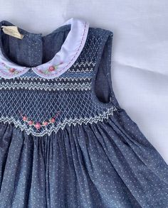 Just a beautiful classic smocked dress made of vintage navy fabric. It has peter pan collar and hand smocking around the chess. Very comfortable, suitable for everyday wear as well as formal occasions. * 100% Cotton * Handmade * Tie at the back * Lightweight, soft cotton, comfortable, and ready to play * Hand wash or machine wash on a delicate setting We are based in Sydney, New South Wales, Australia. We ship within Australia and to other countries as well. The shipping fee is vary based on the Smocking Dress, Smocked Bishop Dress, Hand Smocking, Hand Smocked Dress, Smocked Baby Dresses, Smocked Clothes, Frock Patterns, Kids Frocks Design, New South Wales Australia