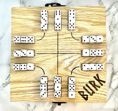 a wooden board game with dices on it