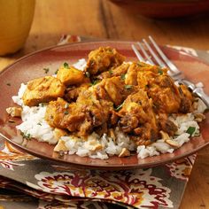 a brown plate topped with rice and chicken